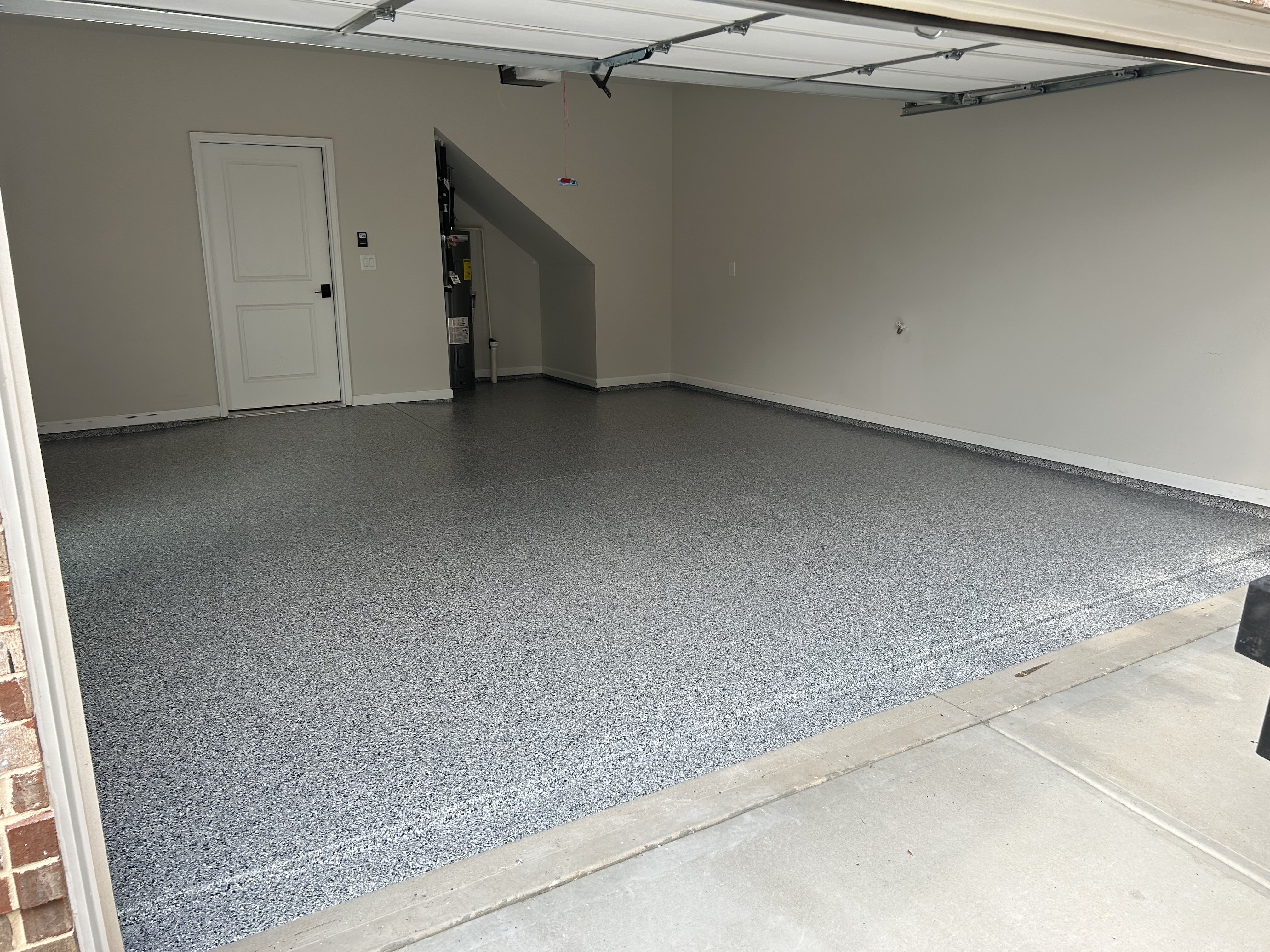 Clean and organized garage with coated floor